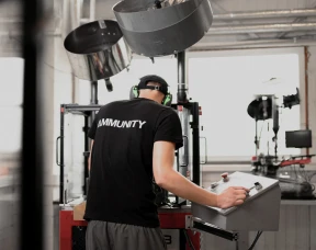 Ammunition worker manufactures bullets